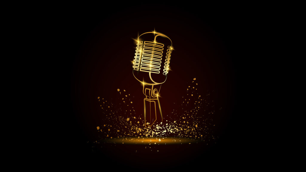 Golden microphone with golden sparks flying up in the air.